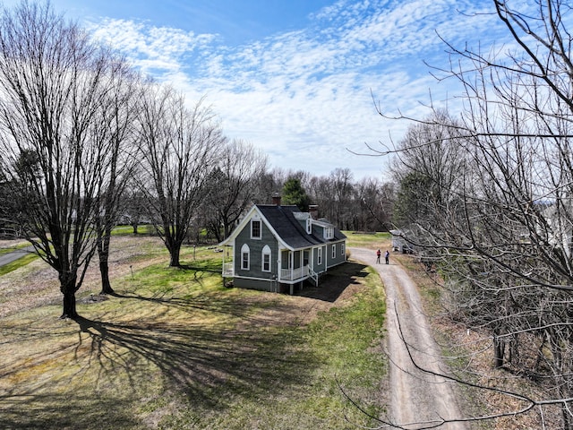 741 Mapleton Ave, Suffield, CT 06078 - view of home's exterior featuring a chimney and dirt driveway
