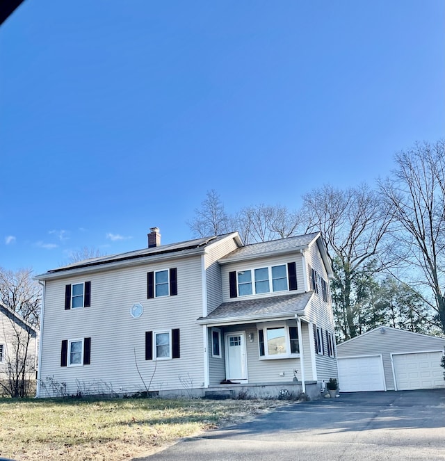 64 Chestnut Cir, Suffield, CT 06093 - traditional-style home with a detached garage, a chimney, an outdoor structure, and roof with shingles