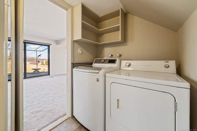 laundry area with light carpet, independent washer and dryer, and laundry area