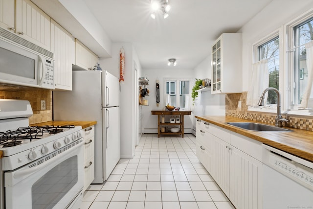 8 Lyle Ct Unit J, Farmington, CT 06032 - kitchen featuring white appliances, wood counters, a sink, a baseboard radiator, and decorative backsplash