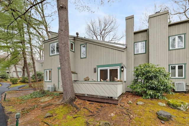 8 Lyle Ct Unit J, Farmington, CT 06032 - rear view of house with cooling unit and a chimney