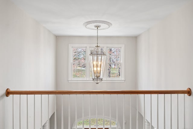interior details featuring a notable chandelier