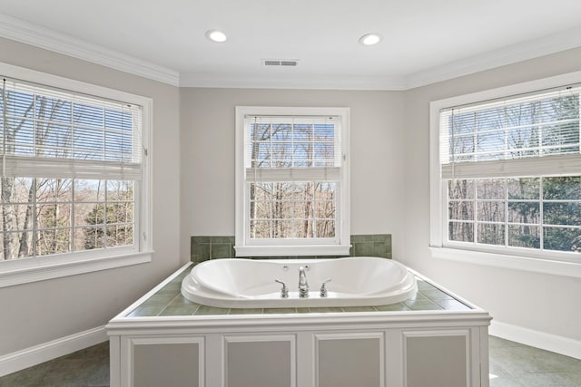 bathroom with visible vents, baseboards, a garden tub, and a healthy amount of sunlight