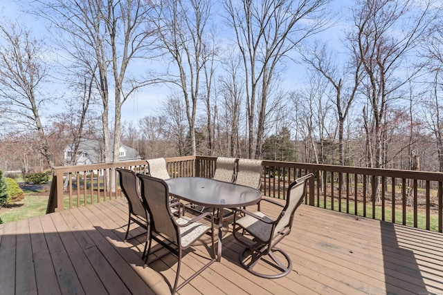wooden terrace featuring outdoor dining area