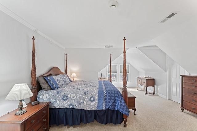 carpeted bedroom with visible vents, baseboards, and vaulted ceiling