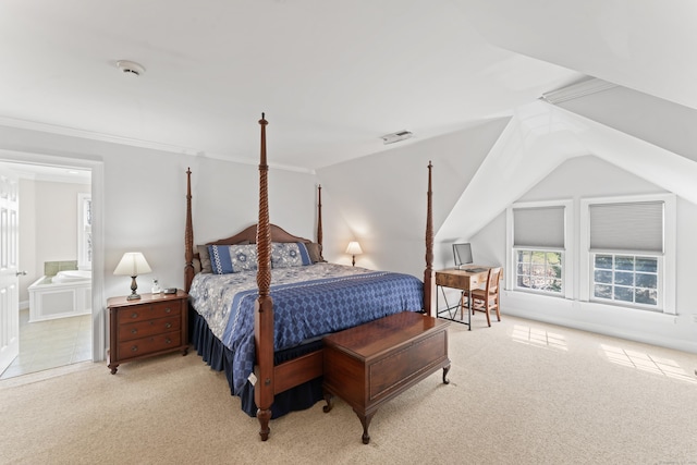 bedroom with visible vents, crown molding, carpet floors, connected bathroom, and lofted ceiling
