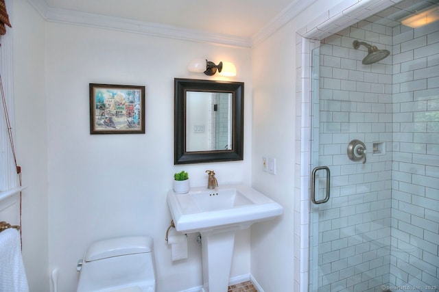full bathroom featuring a stall shower, crown molding, and toilet