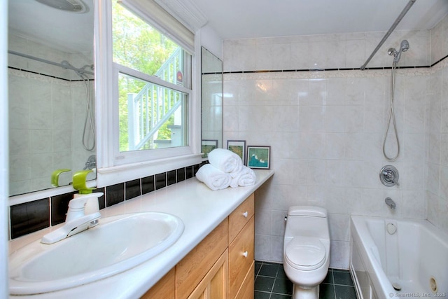 full bath with tile patterned flooring, tile walls, plenty of natural light, and vanity