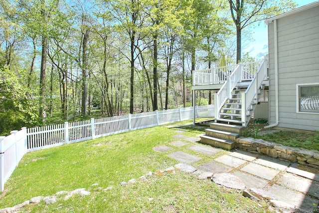 view of yard featuring stairway and a fenced backyard