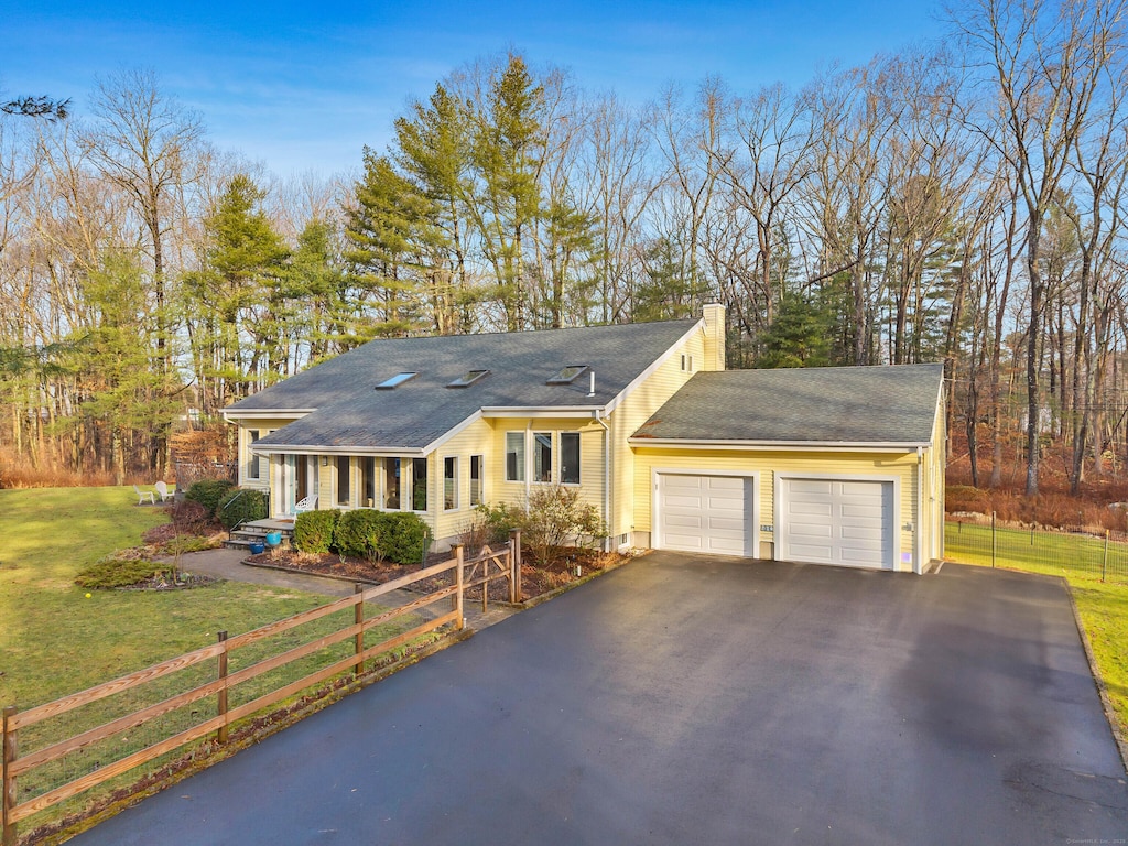 230 Cow Hill Rd, Clinton, CT 06413 - ranch-style house with an attached garage, driveway, a fenced front yard, a front lawn, and a chimney