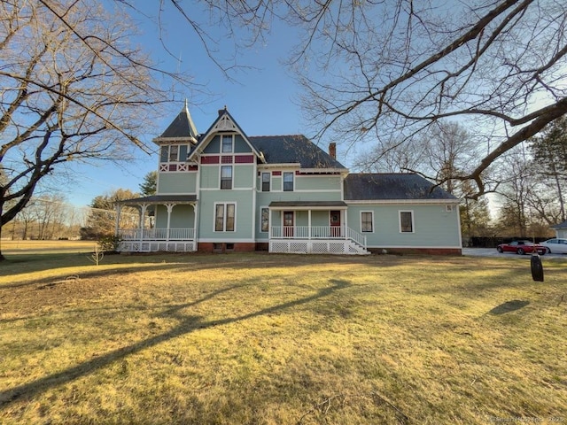 1063 Main St, South Windsor, CT 06074 - victorian-style house featuring a porch, a front yard, and a chimney