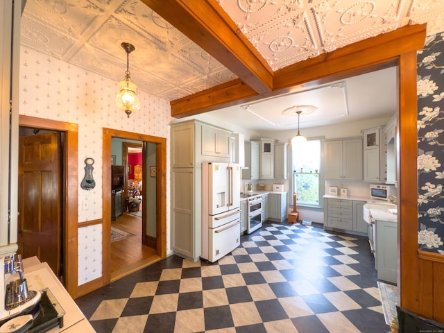 1063 Main St, South Windsor, CT 06074 - kitchen with white appliances, light countertops, wallpapered walls, gray cabinets, and dark floors