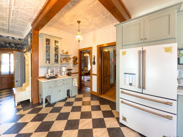 1063 Main St, South Windsor, CT 06074 - kitchen with high end white refrigerator, an ornate ceiling, light countertops, glass insert cabinets, and wallpapered walls