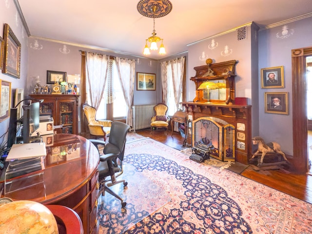 1063 Main St, South Windsor, CT 06074 - home office with ornamental molding, wood finished floors, radiator heating unit, and a fireplace with flush hearth