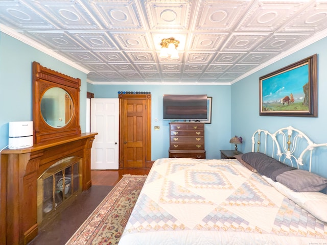 1063 Main St, South Windsor, CT 06074 - bedroom with wood finished floors, an ornate ceiling, and a fireplace with flush hearth