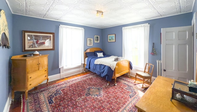 1063 Main St, South Windsor, CT 06074 - bedroom with an ornate ceiling and wood finished floors