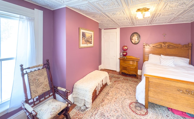 1063 Main St, South Windsor, CT 06074 - bedroom with wood finished floors and an ornate ceiling