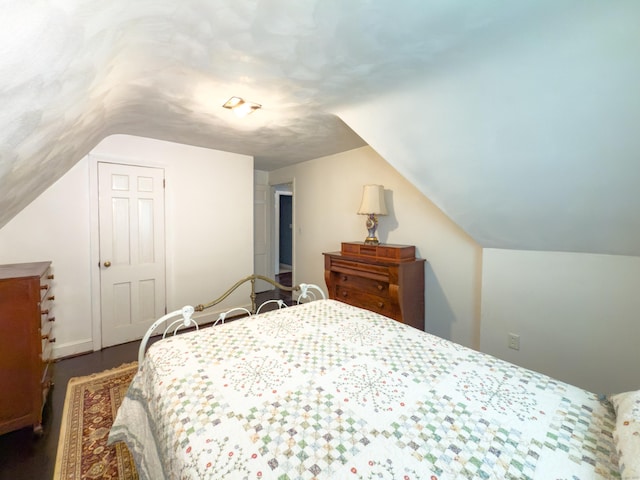 1063 Main St, South Windsor, CT 06074 - bedroom featuring vaulted ceiling and dark wood-style flooring