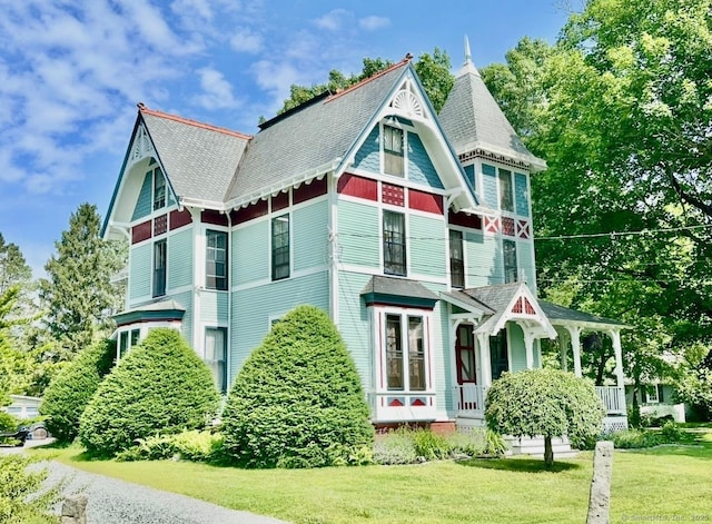 1063 Main St, South Windsor, CT 06074 - view of home's exterior featuring a lawn and covered porch