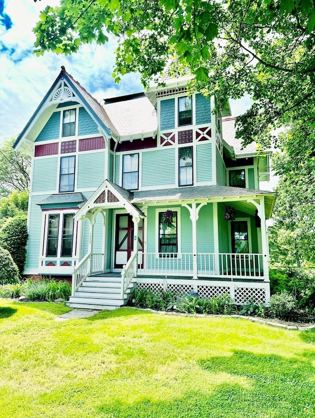 1063 Main St, South Windsor, CT 06074 - victorian-style house with a front lawn and covered porch