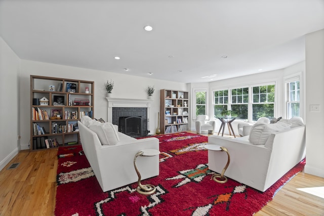 169 High Meadow Ln, Groton, CT 06355 - living area featuring wood finished floors, a fireplace, baseboards, and recessed lighting