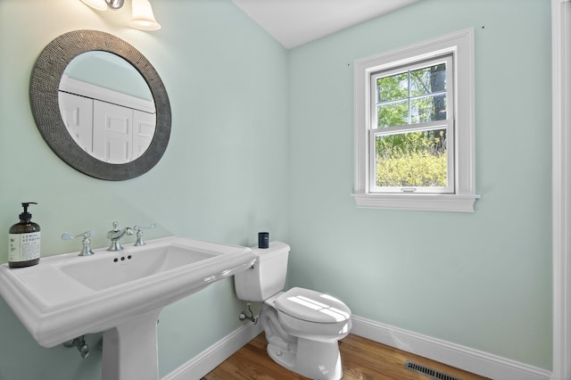 169 High Meadow Ln, Groton, CT 06355 - half bath with baseboards, wood finished floors, toilet, and a sink