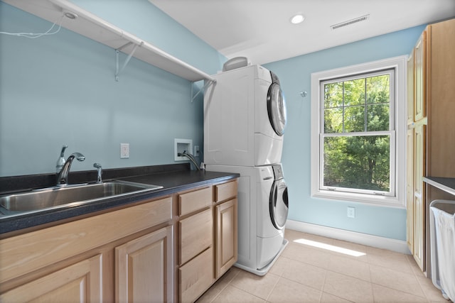 169 High Meadow Ln, Groton, CT 06355 - laundry area with stacked washer / dryer, cabinet space, light tile patterned floors, baseboards, and recessed lighting