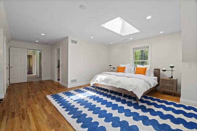 169 High Meadow Ln, Groton, CT 06355 - bedroom with a skylight, wood finished floors, baseboards, and recessed lighting