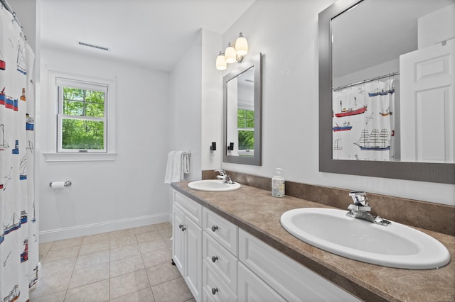169 High Meadow Ln, Groton, CT 06355 - full bath featuring tile patterned flooring, double vanity, baseboards, and curtained shower