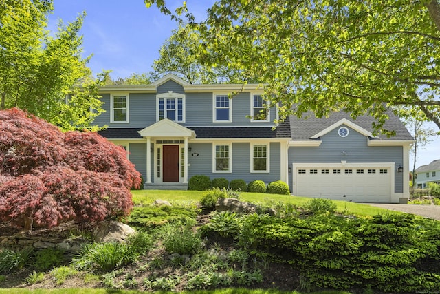 169 High Meadow Ln, Groton, CT 06355 - view of front of home featuring asphalt driveway, a garage, and roof with shingles