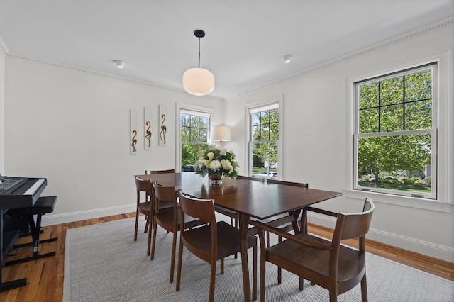 169 High Meadow Ln, Groton, CT 06355 - dining room featuring crown molding, baseboards, and wood finished floors
