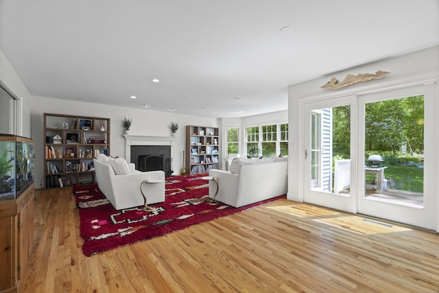 169 High Meadow Ln, Groton, CT 06355 - living room with a fireplace, wood finished floors, and recessed lighting
