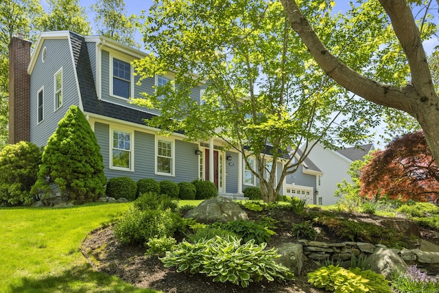 169 High Meadow Ln, Groton, CT 06355 - view of front of house with a gambrel roof, a chimney, a front yard, a shingled roof, and a garage