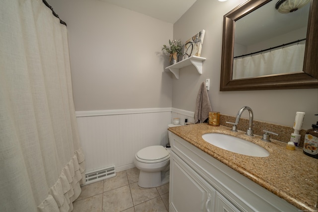 125 Northford Rd, Branford, CT 06405 - bathroom featuring visible vents, wainscoting, vanity, tile patterned floors, and toilet
