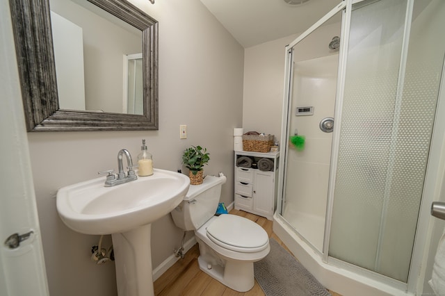 125 Northford Rd, Branford, CT 06405 - bathroom featuring baseboards, a stall shower, toilet, and wood finished floors