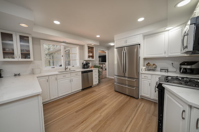 125 Northford Rd, Branford, CT 06405 - kitchen with white cabinets, appliances with stainless steel finishes, and a sink