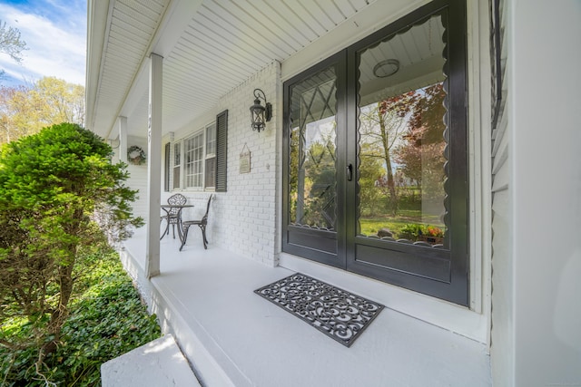 125 Northford Rd, Branford, CT 06405 - doorway to property with a porch and brick siding
