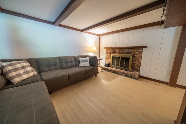 125 Northford Rd, Branford, CT 06405 - living room featuring beamed ceiling, baseboards, light wood finished floors, and a fireplace