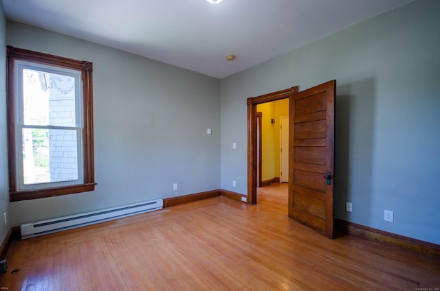 93 Broad St, Norwich, CT 06360 - spare room featuring a baseboard heating unit, light wood-style flooring, and baseboards