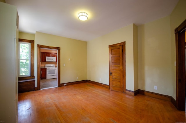 93 Broad St, Norwich, CT 06360 - unfurnished room featuring light wood-style flooring and baseboards