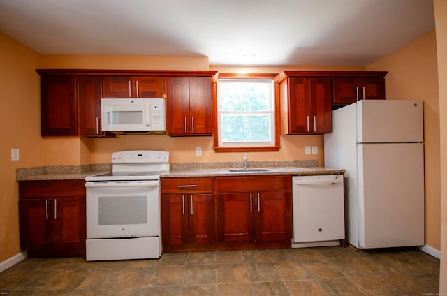 93 Broad St, Norwich, CT 06360 - kitchen with white appliances, a sink, dark brown cabinets, and baseboards