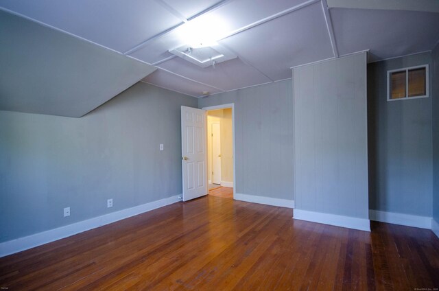 93 Broad St, Norwich, CT 06360 - spare room featuring wood finished floors, lofted ceiling, and baseboards