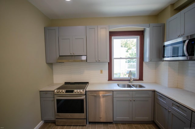 93 Broad St, Norwich, CT 06360 - kitchen featuring appliances with stainless steel finishes, a sink, and gray cabinets