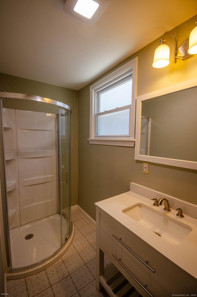 93 Broad St, Norwich, CT 06360 - bathroom featuring vanity, a shower stall, baseboards, and tile patterned flooring