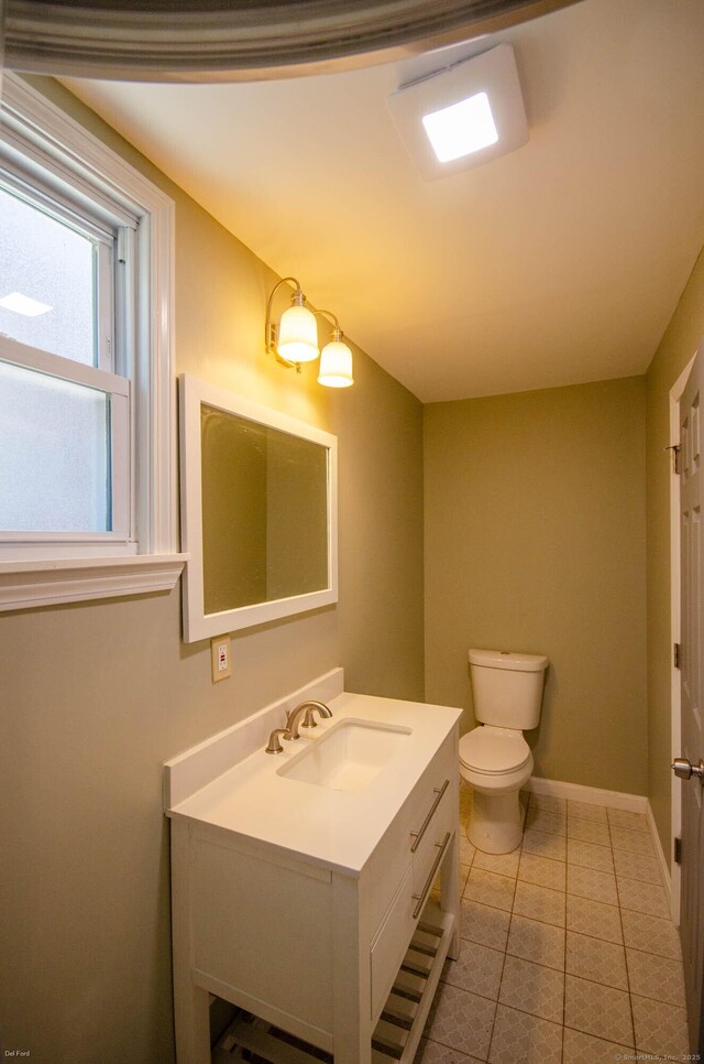 93 Broad St, Norwich, CT 06360 - bathroom featuring vanity, toilet, tile patterned flooring, and baseboards