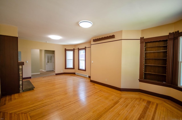 93 Broad St, Norwich, CT 06360 - spare room with a baseboard radiator, light wood-type flooring, and baseboards