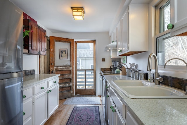 15 Echo St, Salisbury, CT 06068 - kitchen featuring freestanding refrigerator, a sink, light countertops, and white cabinets