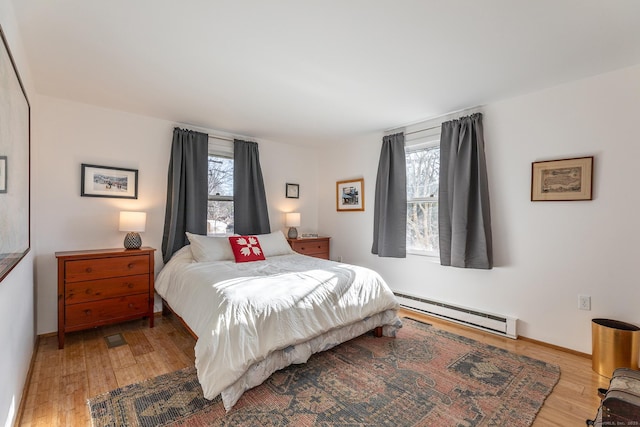 15 Echo St, Salisbury, CT 06068 - bedroom with a baseboard radiator, multiple windows, light wood-style floors, and baseboards