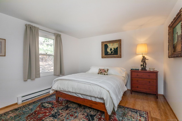 15 Echo St, Salisbury, CT 06068 - bedroom with a baseboard heating unit and light wood-style floors