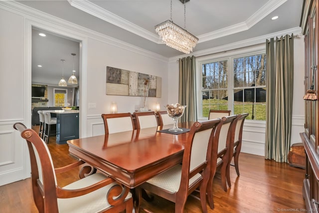158 N Seir Hill Rd, Norwalk, CT 06850 - dining space featuring crown molding, dark wood finished floors, a chandelier, and a decorative wall